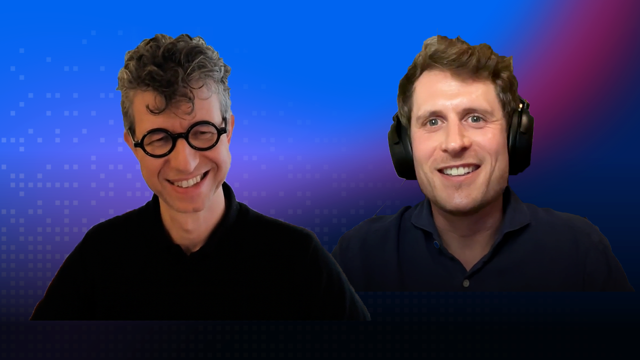 A person with curly hair and round glasses is smiling next to another person wearing headphones, both against a blue and purple gradient background.